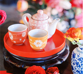 A tea set on a table with two cups